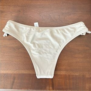 Aeri Cheeky tan swim bottoms never worn size small